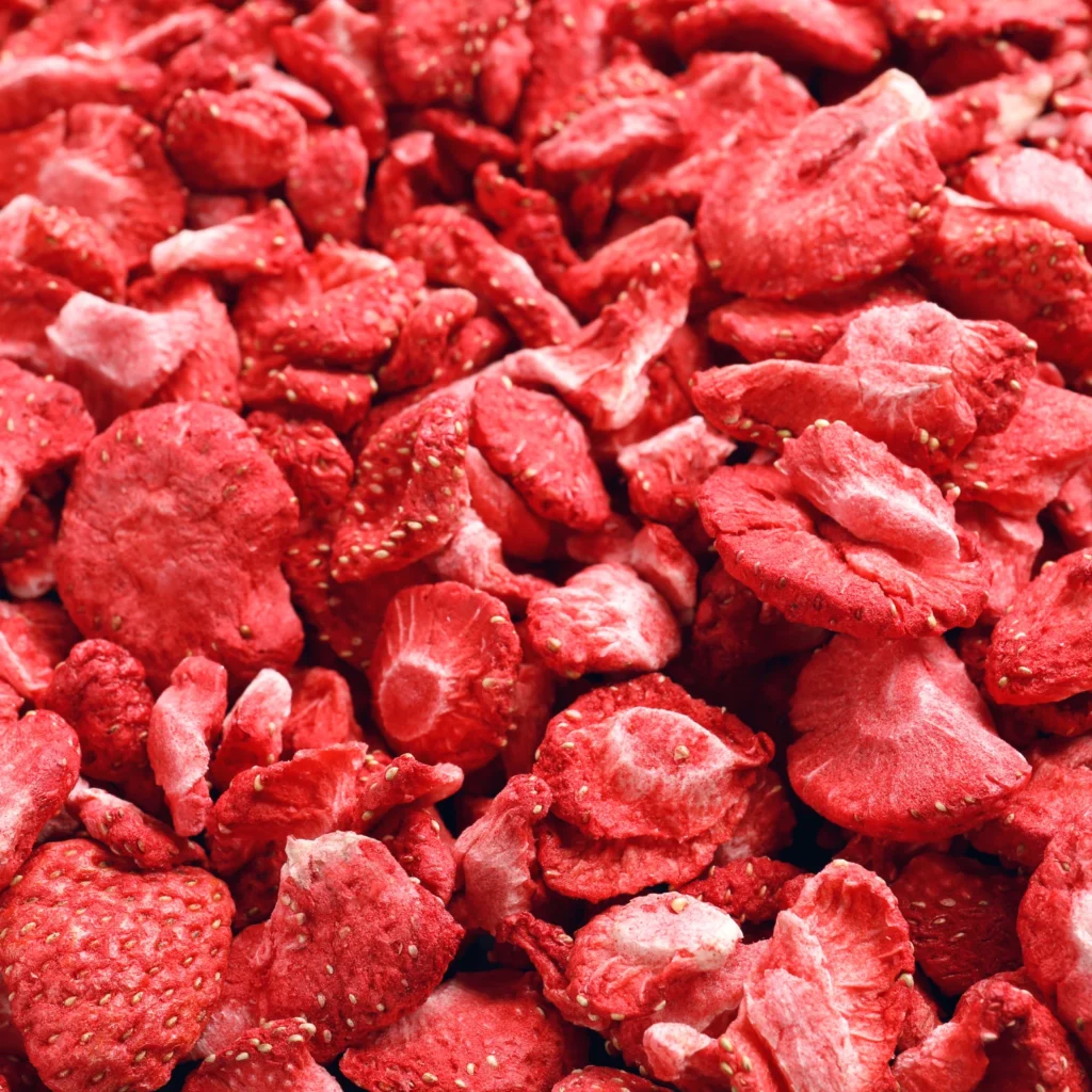 Close-up of organic freeze-dried strawberry slices with a light, crispy texture.