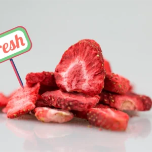 Dried strawberries with a sign reading 'Fresh', showcasing vibrant colors.